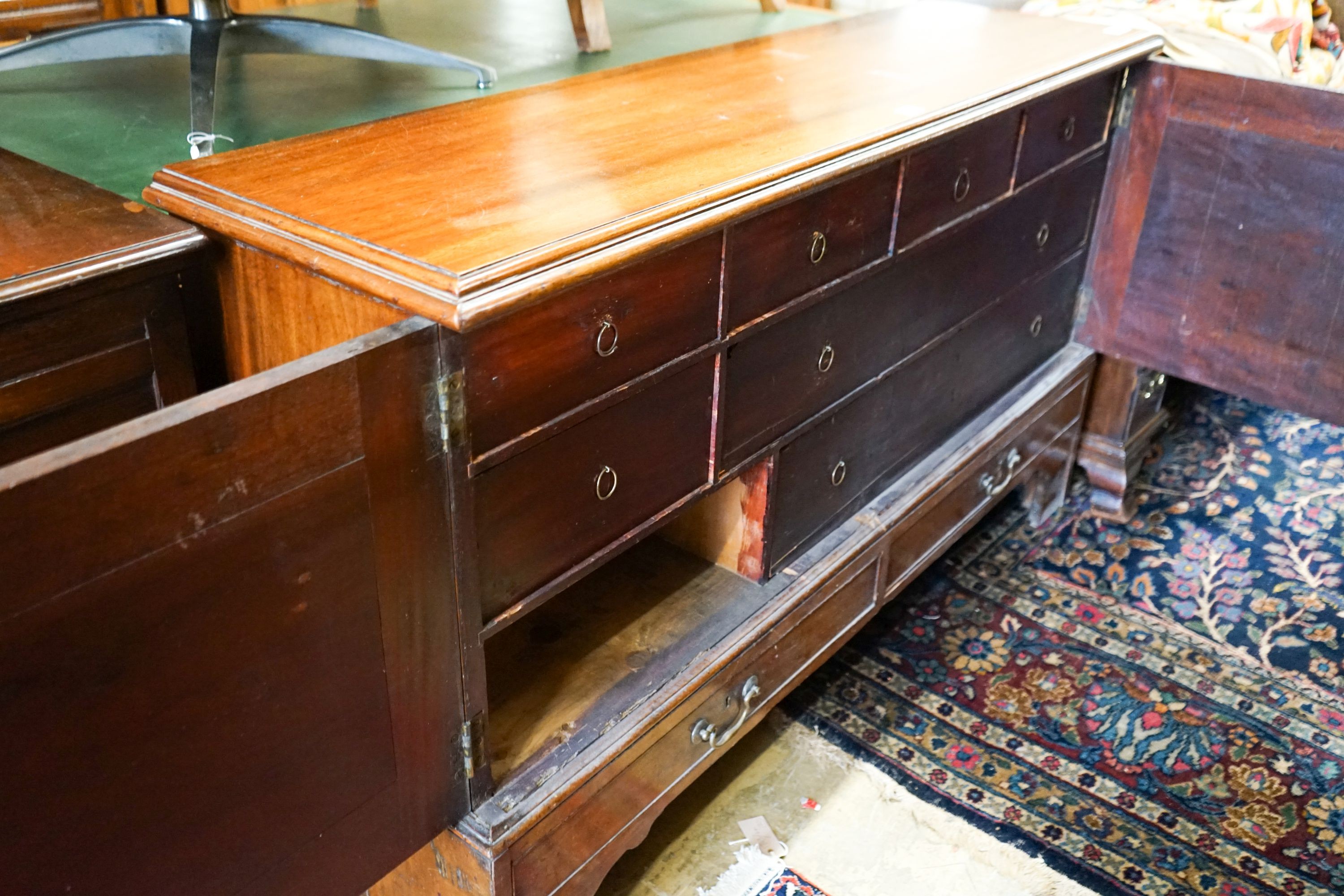 A George III mahogany dwarf cabinet constructed from old timber, width 140cm, depth 39cm, height 85cm